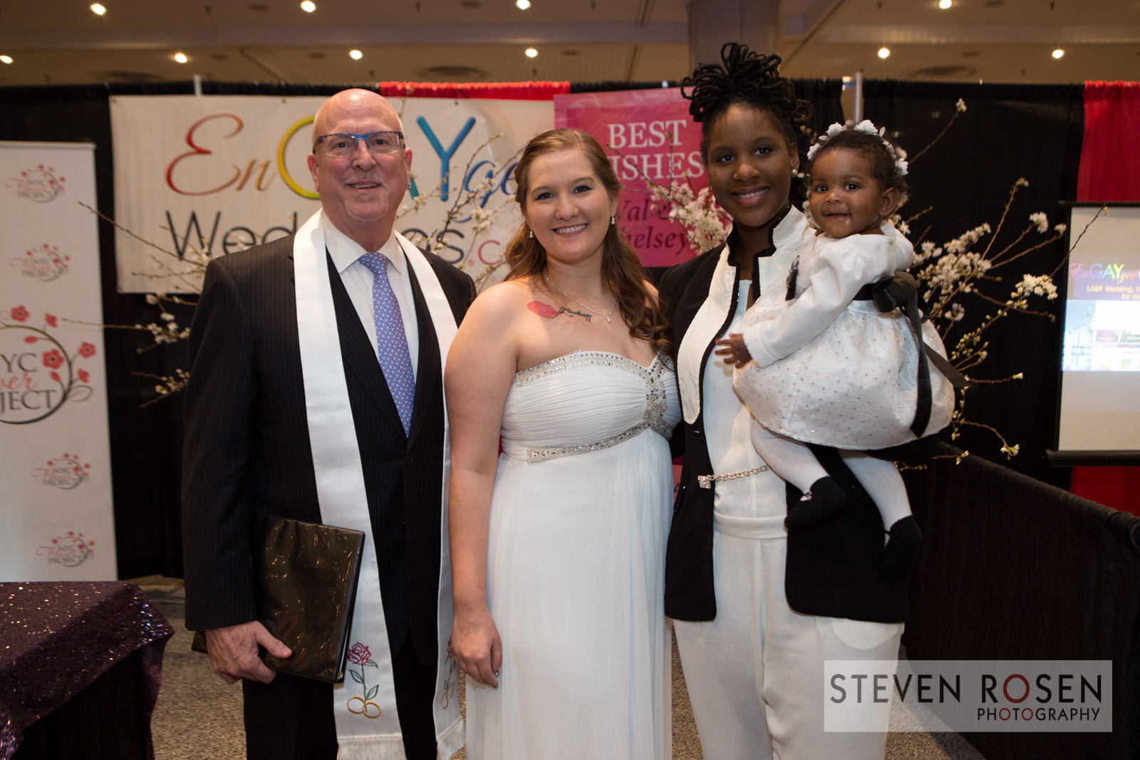 Val, Chelsey and their daughter Emerson with Reverend Will Mercer who performed the ceremony