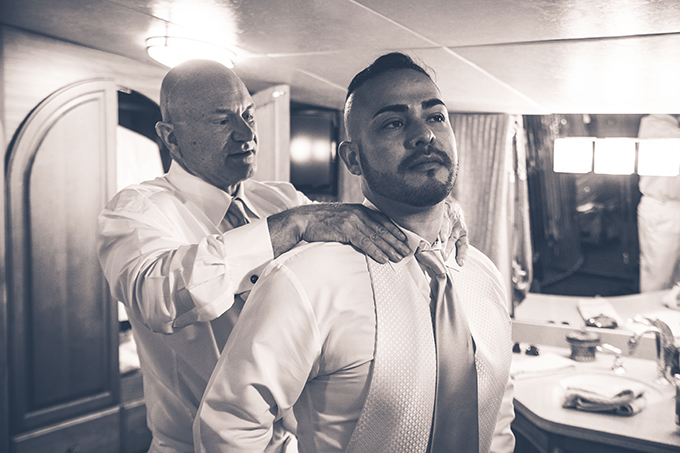 Two Grooms getting ready for wedding ceremony - Charter Yachts of Newport Beach