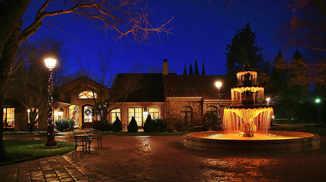 Wine Country cobble stoned Fountain Courtyard at night Santa Rosa CA - Vintners Resort