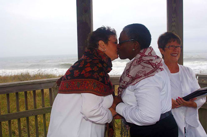 Rev. Tanya Young Venice, Florida Weddings - Brides kissing on the beach