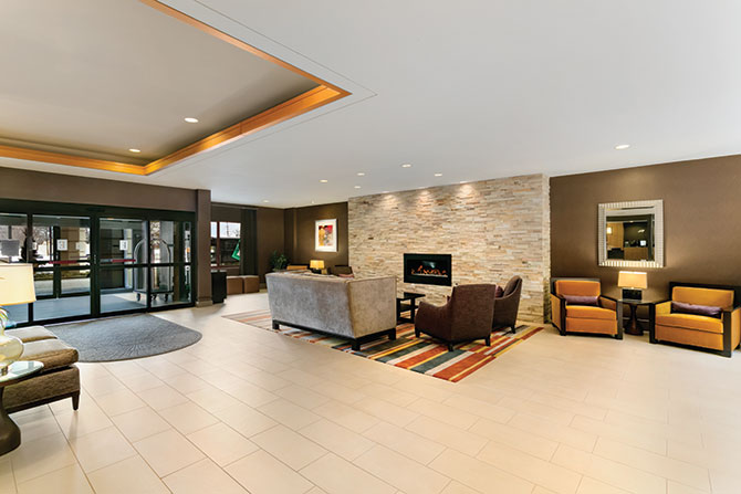 Embassy Suites Chicago - North Shore / Deerfield - Contemporary lobby with fireplace