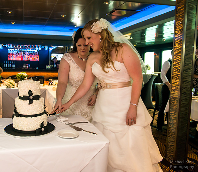 Entertainment Cruises - Lesbian wedding couple cutting cake