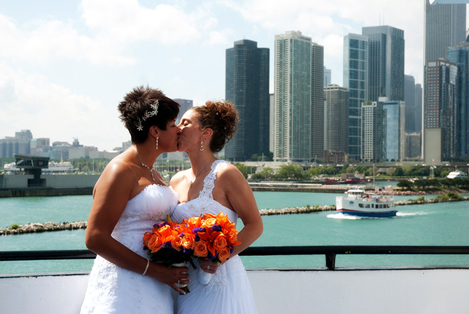 Entertainment Cruises - LGBT Brides kiss and Chicago Skyline