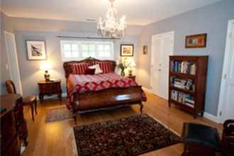 Hambleton Inn - Bed and Breakfast guestroom The Chesapeake features Italian Walnut berle antique queen bed