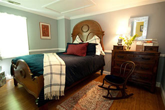 Hambleton Inn - Guestroom with walnut antique bed and chest