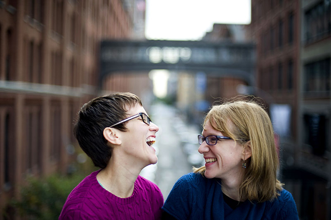 LGBT couple laughing - Studio A Images