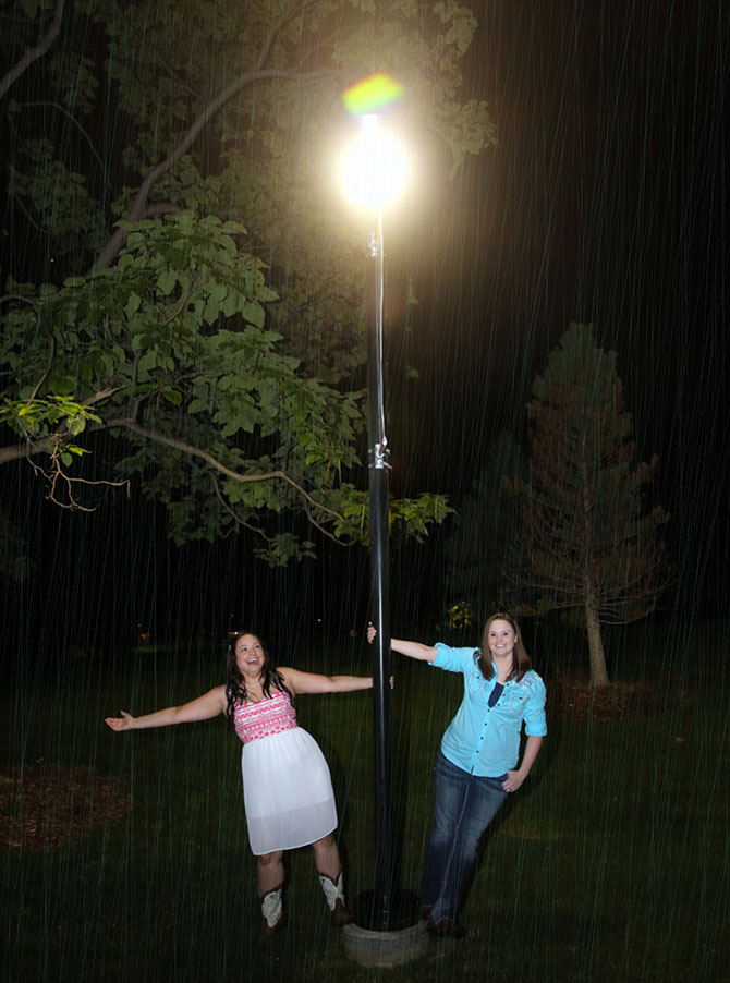 Ricci Photography New Mexico - Lesbian brides on a light pole in the rain