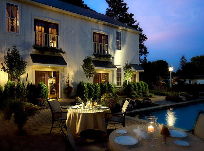 The Inn At Leola Village romantic table by the pool at night