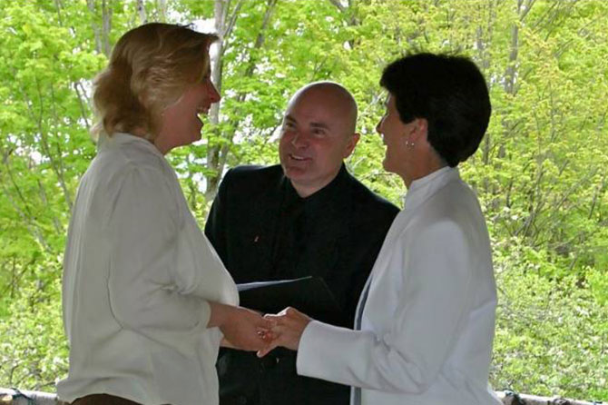 Officiant performing lesbian wedding ceremony in Vermont Central Vermont LGBT Wedding Officiant - JP Greg Trulson