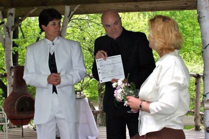 LGBT Marriage officiant providing wedding license to lesbian couple in Vermont Central Vermont LGBT Wedding Officiant - JP Greg Trulson