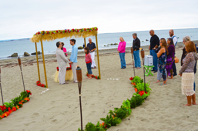 Weddings By The Sea - Gay wedding ceremony beachside with tiki torches