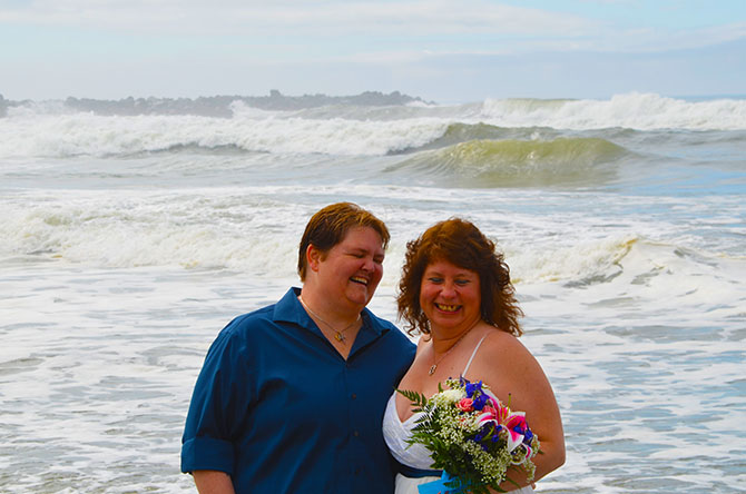 Weddings By The Sea - Lesbian couple in the surf