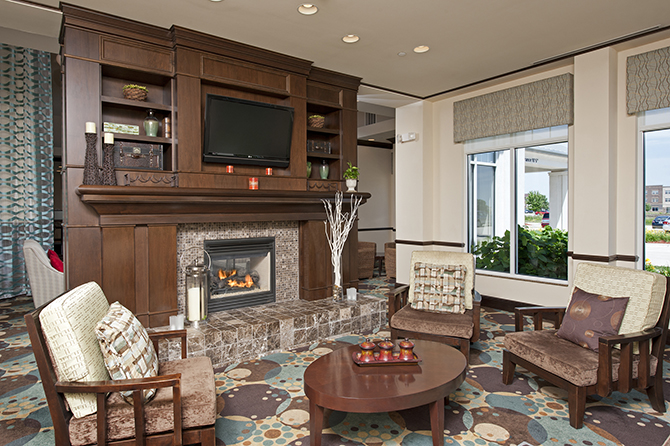 Wooden mantel in hotel lobby - Hilton Garden Inn LGBT Wedding Hotel Ames Iowa