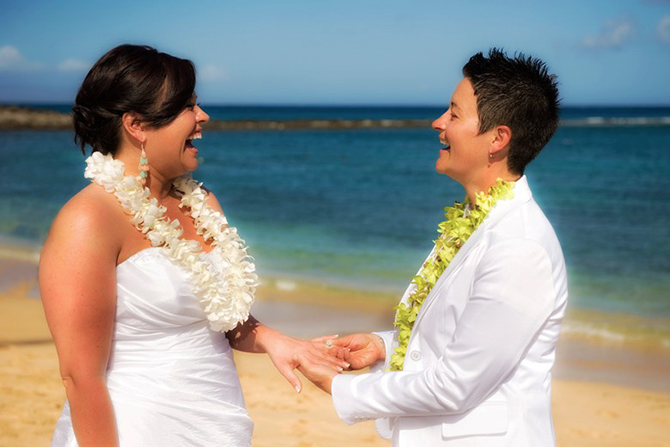 Marry Me Maui Wedding Planners - lgbt brides laughing during beach ceremony