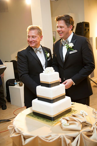 Tasty Catering - two Grooms cutting their wedding cake